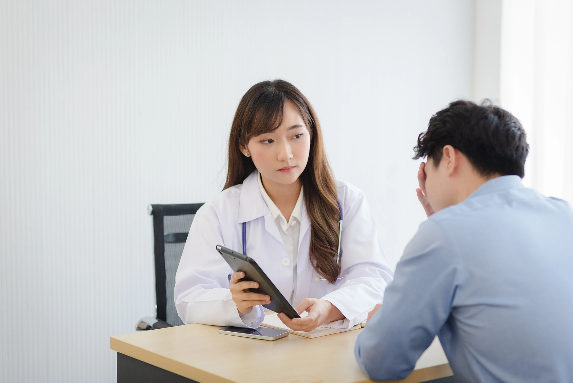 20260508_153748_concerned-doctor-consults-with-patient-in-office-2026-03-13-05-31-07-utc.webp